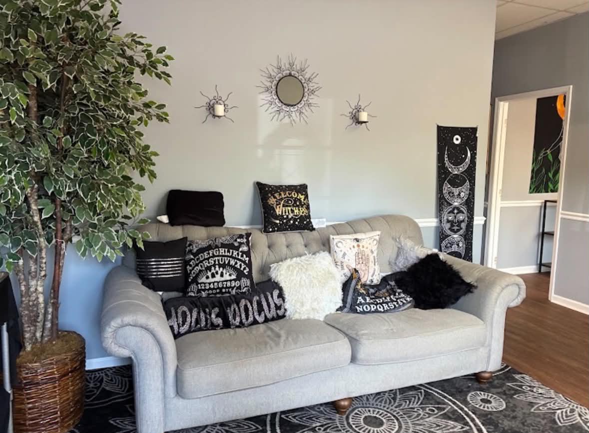 The inviting lobby at Mystic Nook with a comfortable sofa and warm decor